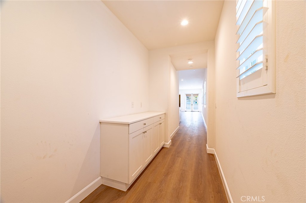 172 Follyhatch Irvine, CA 92618 - Photo 9 of 39 a view of a hallway with wooden floor