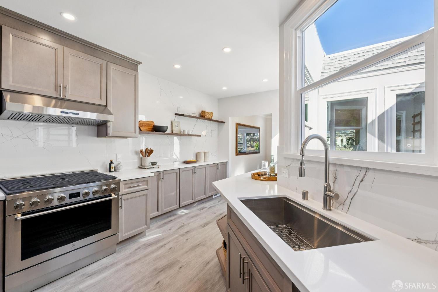 1675 29th Avenue San Francisco, CA 94122 - Photo 15 of 61 a kitchen that has a sink and a stove