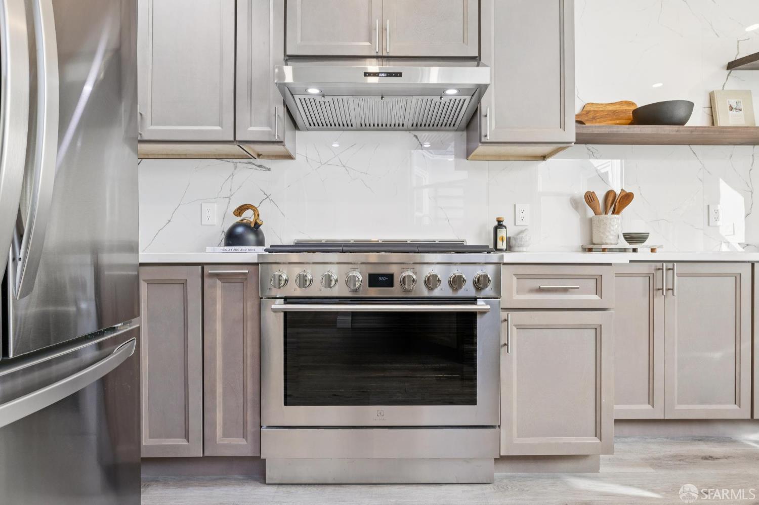1675 29th Avenue San Francisco, CA 94122 - Photo 17 of 61 a stove top oven sitting inside of a kitchen