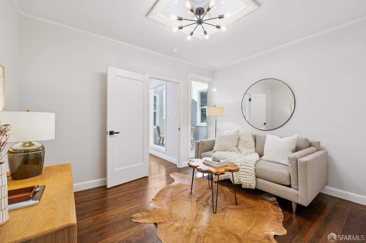1675 29th Avenue San Francisco, CA 94122 - Photo 19 of 61 a living room with furniture a table and wooden floor