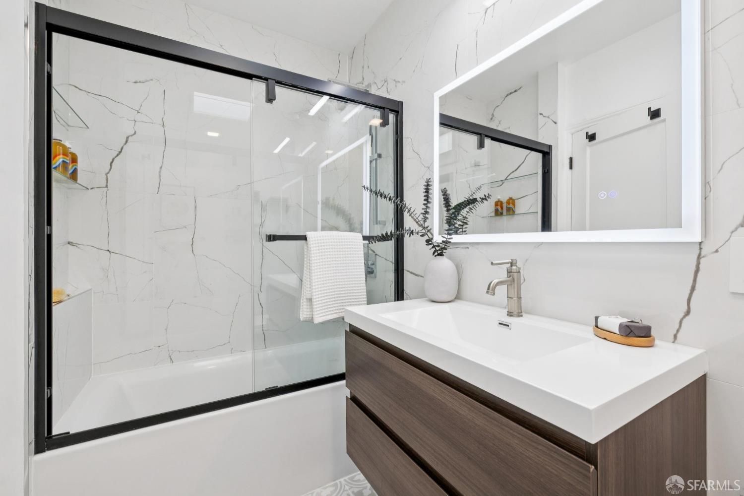 1675 29th Avenue San Francisco, CA 94122 - Photo 24 of 61 a bathroom with a sink and a mirror