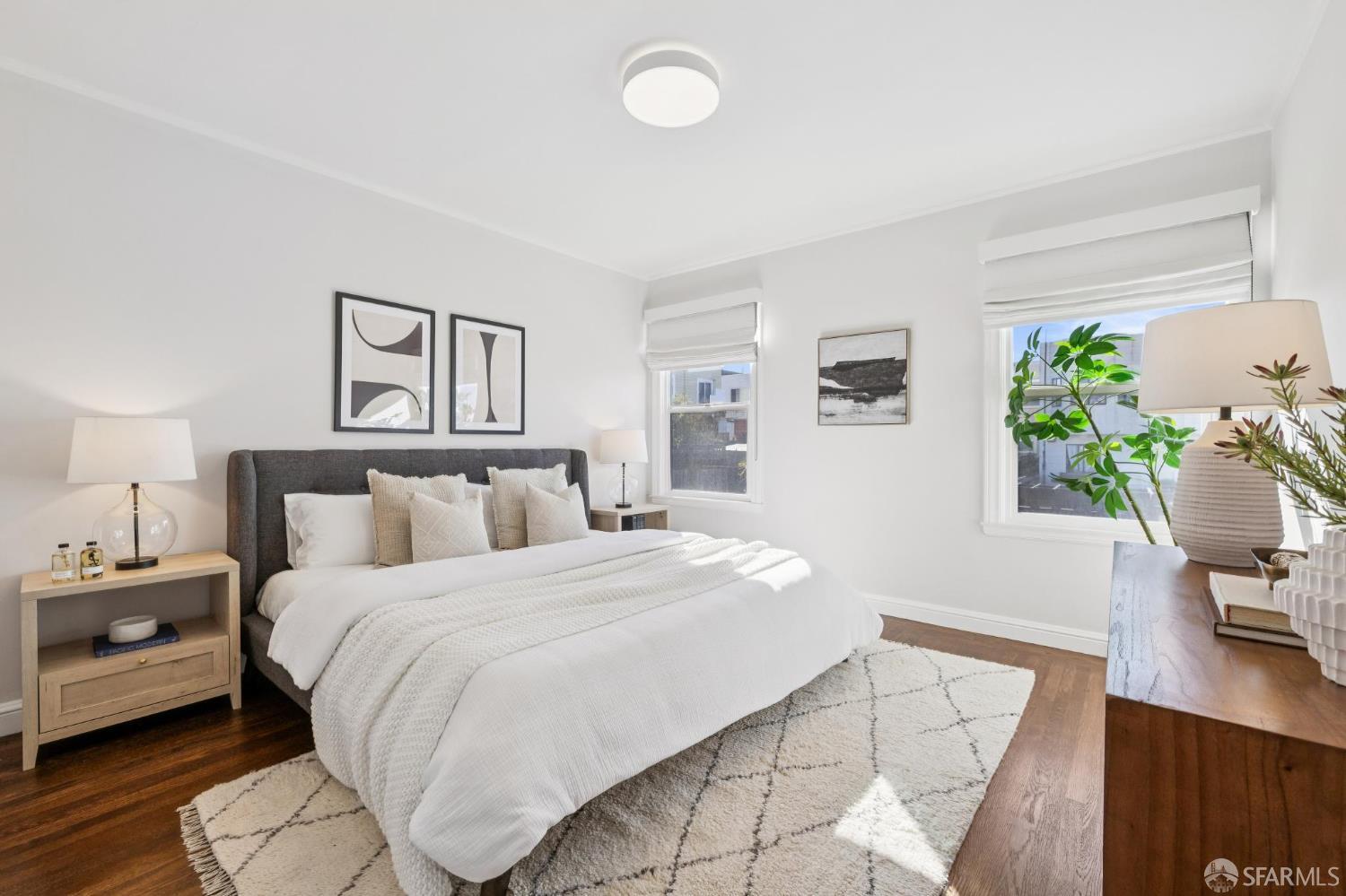 1675 29th Avenue San Francisco, CA 94122 - Photo 26 of 61 a bedroom with a bed window and potted plant on dresser