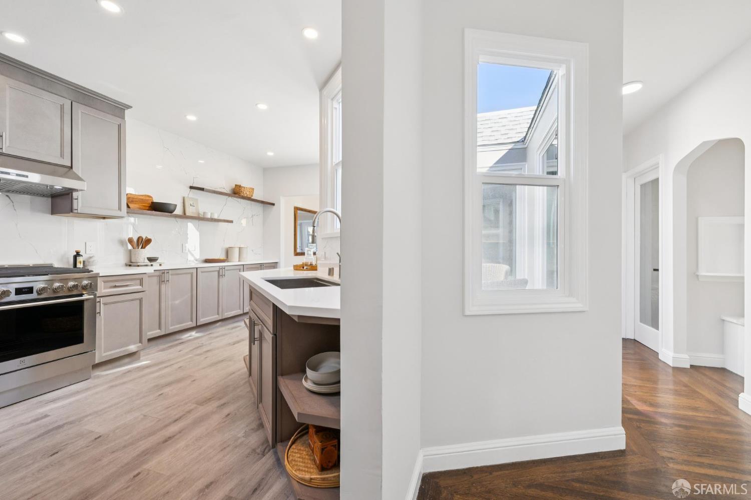 1675 29th Avenue San Francisco, CA 94122 - Photo 32 of 61 a kitchen with white cabinets and appliances