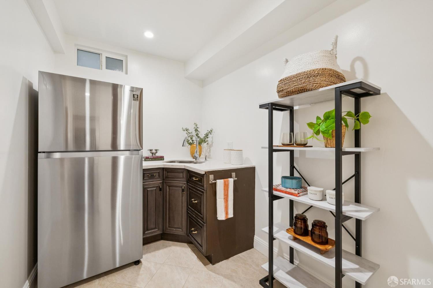 1675 29th Avenue San Francisco, CA 94122 - Photo 37 of 61 a kitchen with stainless steel appliances granite countertop a refrigerator and a stove top oven