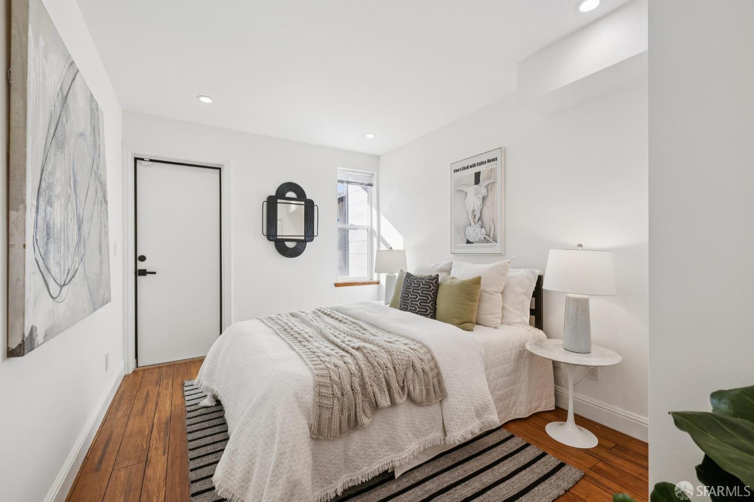 1675 29th Avenue San Francisco, CA 94122 - Photo 44 of 61 a bedroom with a bed and a lamp with the table