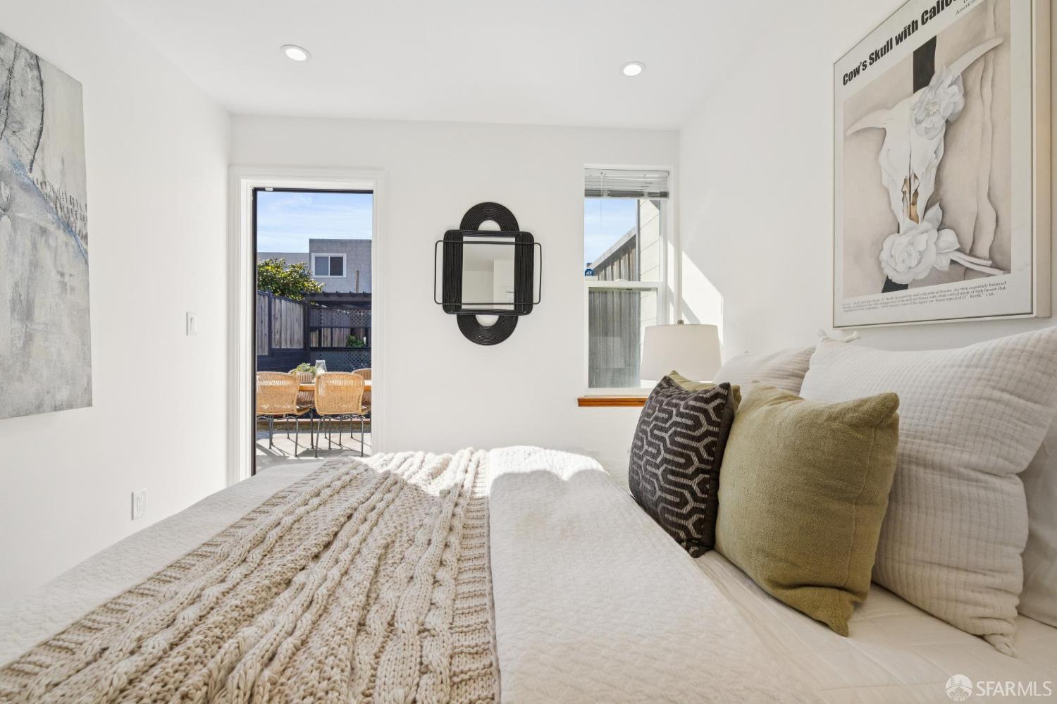 1675 29th Avenue San Francisco, CA 94122 - Photo 46 of 61 a bedroom with a bed and a painting on the wall