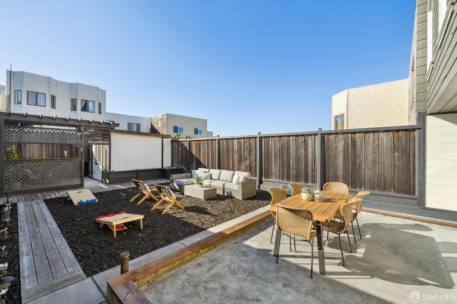 1675 29th Avenue San Francisco, CA 94122 - Photo 52 of 61 a backyard of a house with table and chairs