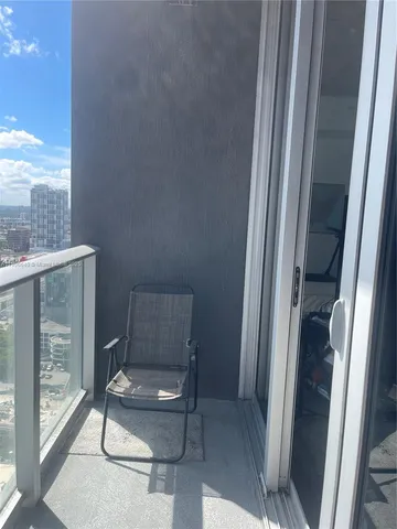 a view of roof deck with patio