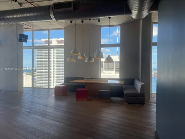 a view of a living room and kitchen