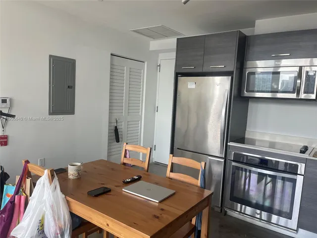 a view of a workspace with furniture