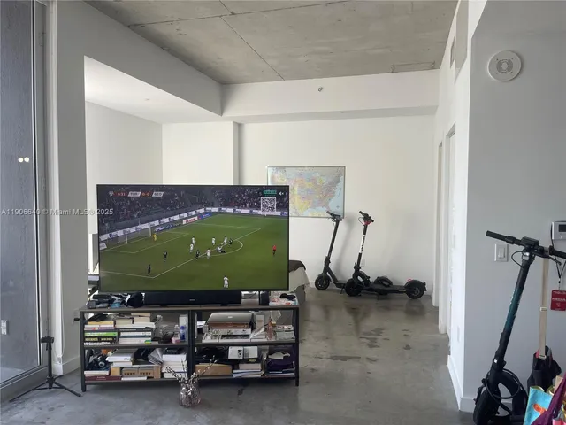 a bedroom with a bed and a mirror