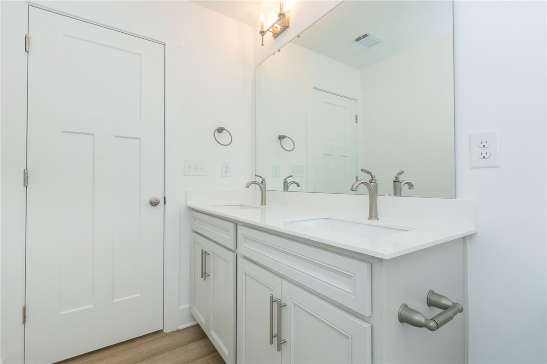 607 WH Kay Lane Anderson, SC 29621 - Photo 28 of 48 Double vanity with sleek fixtures offers ample counter space for daily routines.