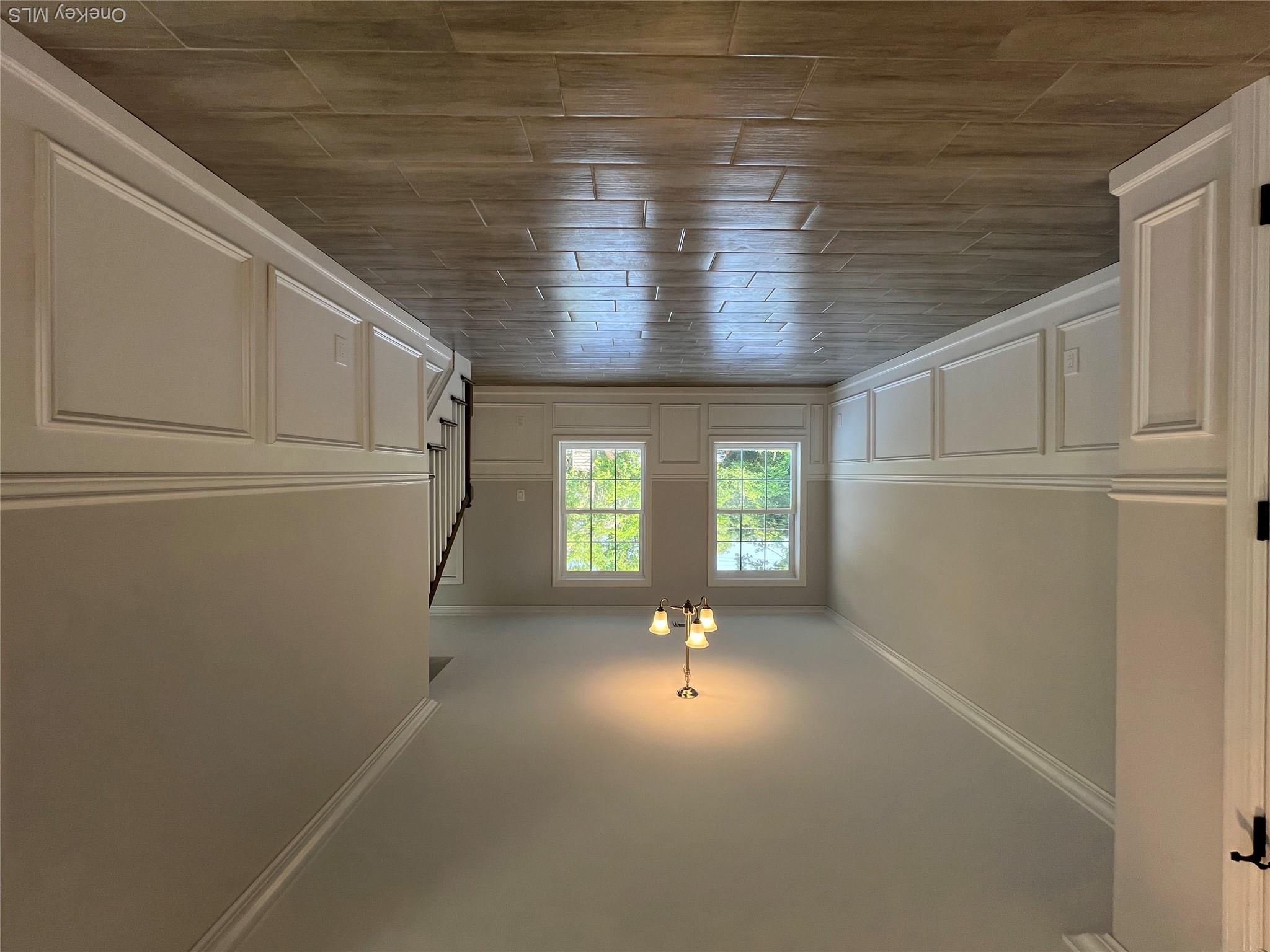 35 Babylon Road Mastic Beach, NY 11951 - Photo 10 of 19 a view of an empty room with wooden floor and a window