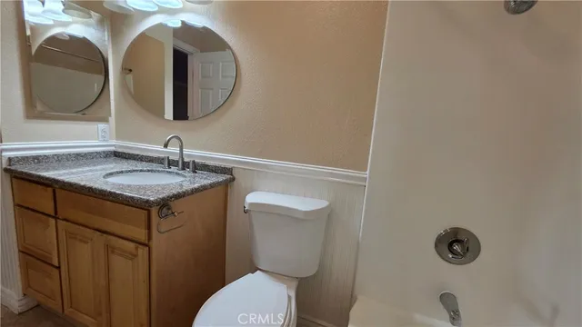 a bathroom with a toilet and a sink