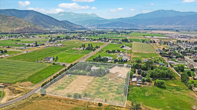 481 East Teancum Road Heber City, UT 84032 - Photo 82 of 89 Expansive rural property featuring a primary residence, substantial open land, mature trees, and a mountain backdrop