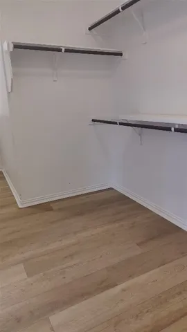 a view of a room with an empty walk in closet