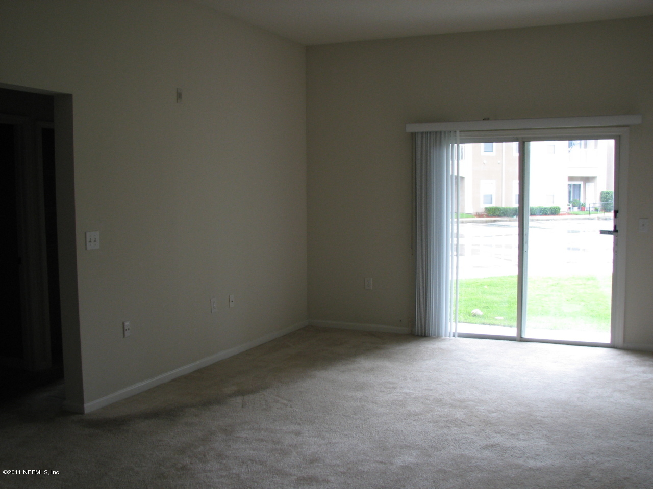 7920 Merrill Road, Unit 2108 Jacksonville, FL 32277 - Photo 3 of 15 a view of an empty room with a window