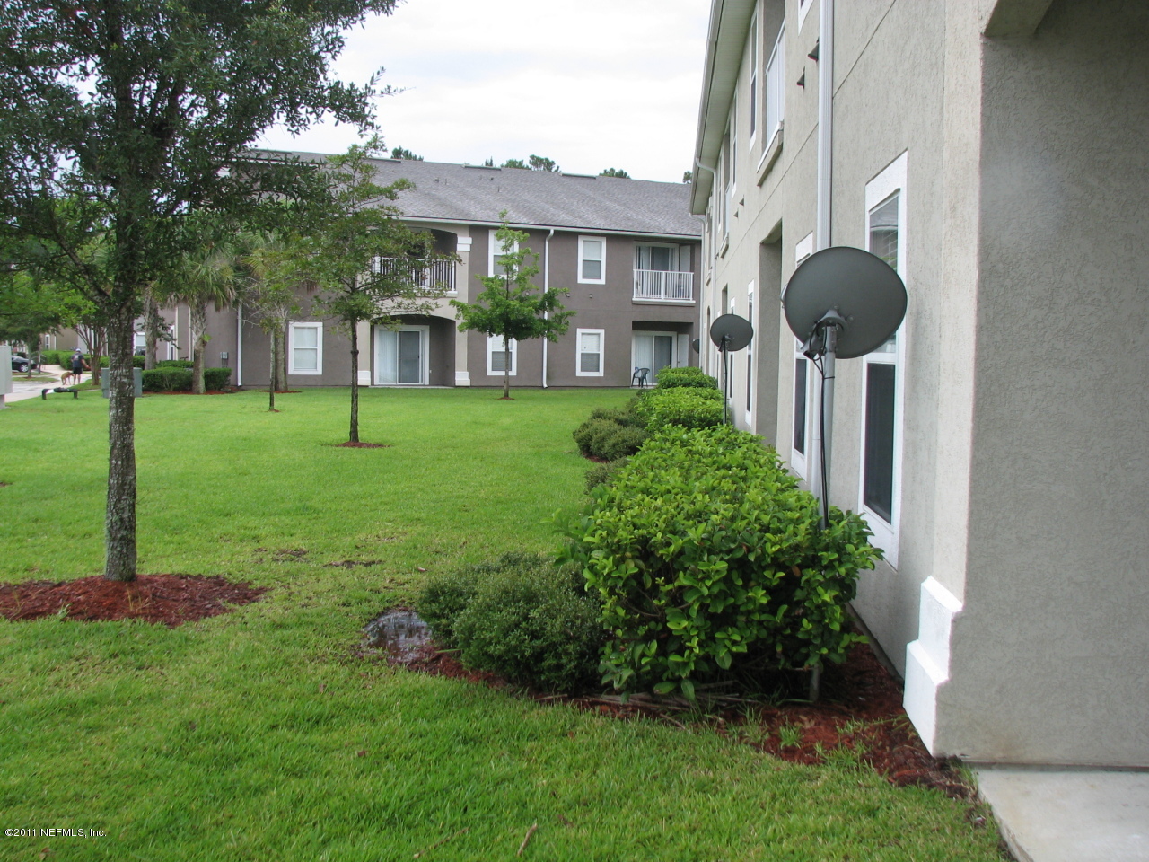 7920 Merrill Road, Unit 2108 Jacksonville, FL 32277 - Photo 6 of 15 a view of a house with backyard and garden