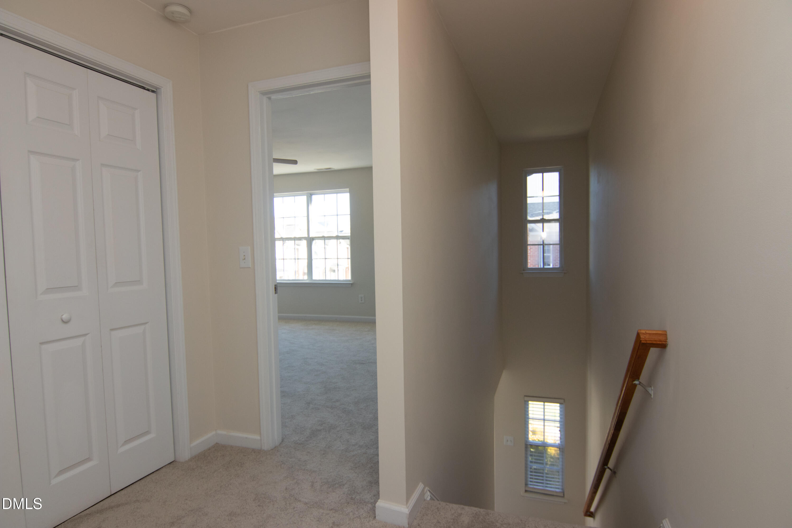 9903 Grettle Court Raleigh, NC 27617 - Photo 16 of 40 an empty room with windows mirror and door