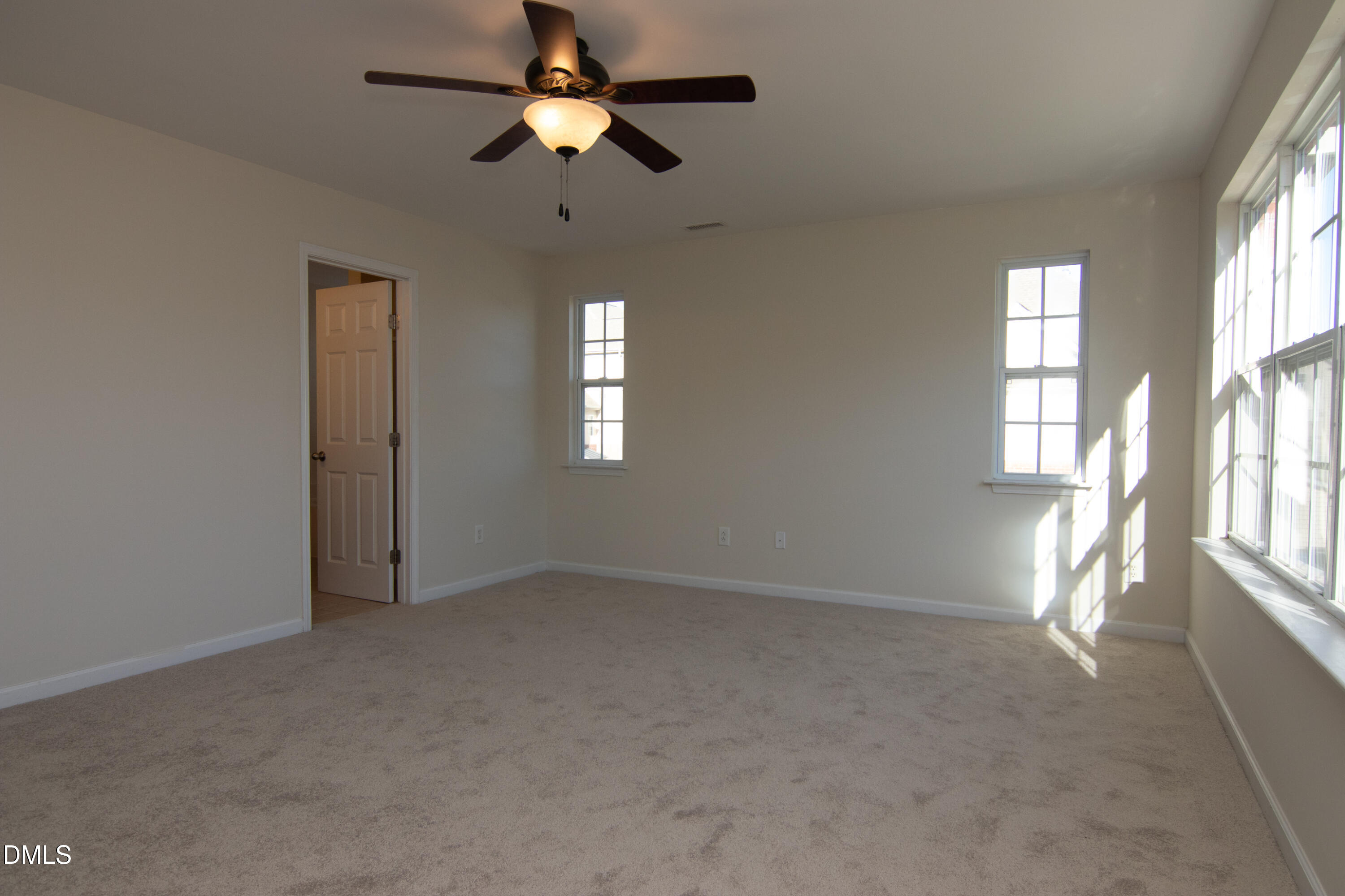 9903 Grettle Court Raleigh, NC 27617 - Photo 20 of 40 an empty room with windows and fan