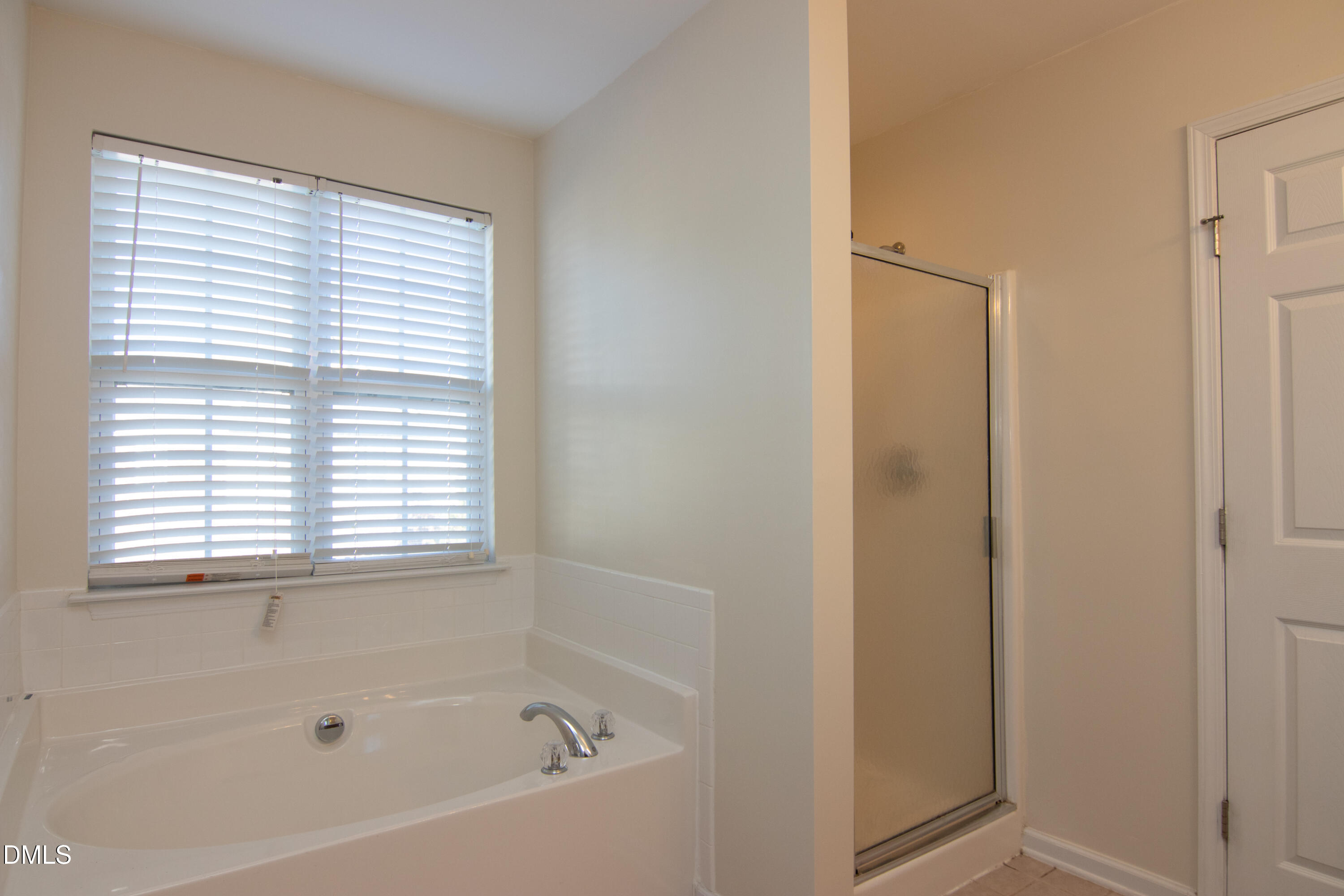 9903 Grettle Court Raleigh, NC 27617 - Photo 24 of 40 a bathroom with a bathtub