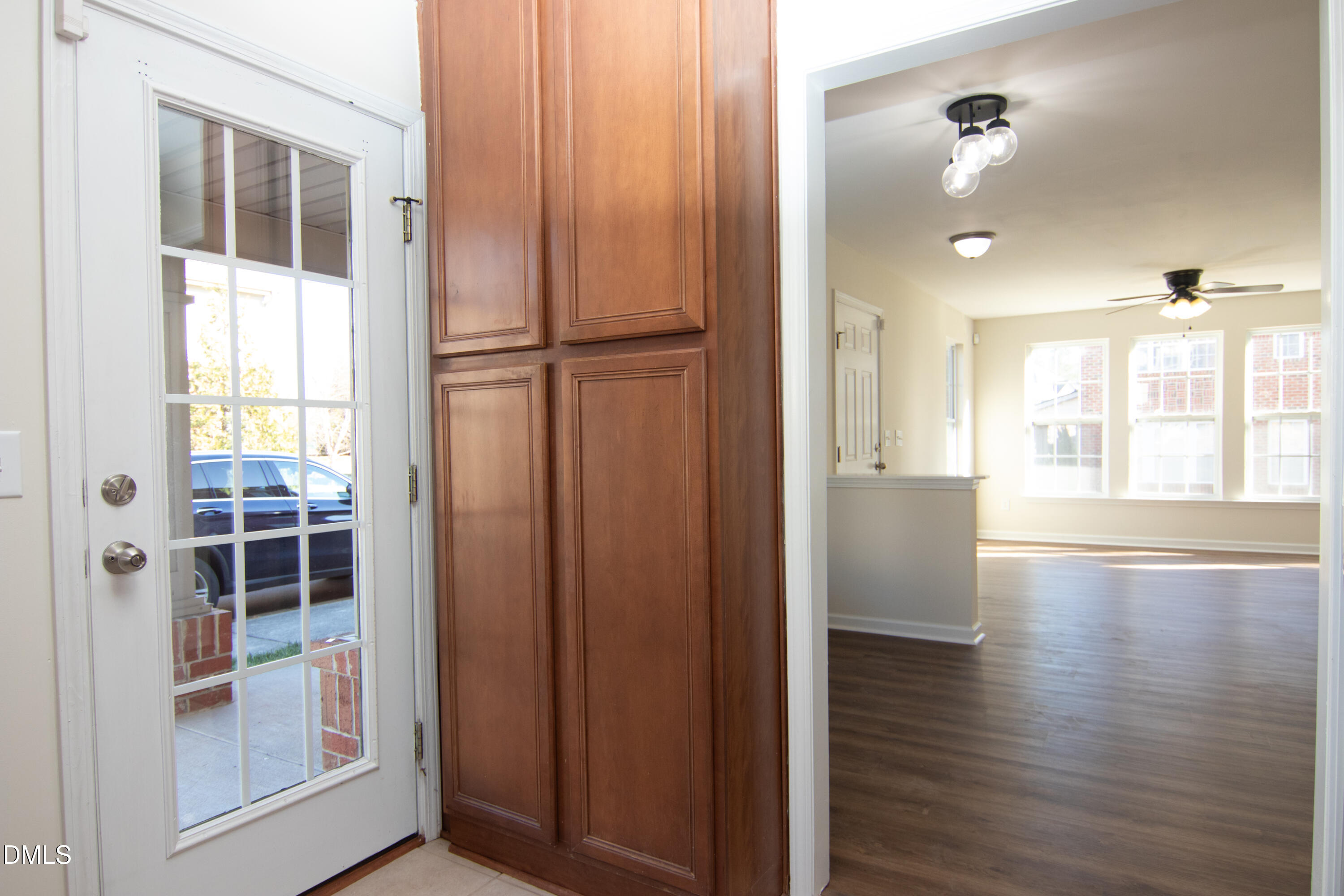 9903 Grettle Court Raleigh, NC 27617 - Photo 5 of 40 a view of a hallway with wooden floor and a window