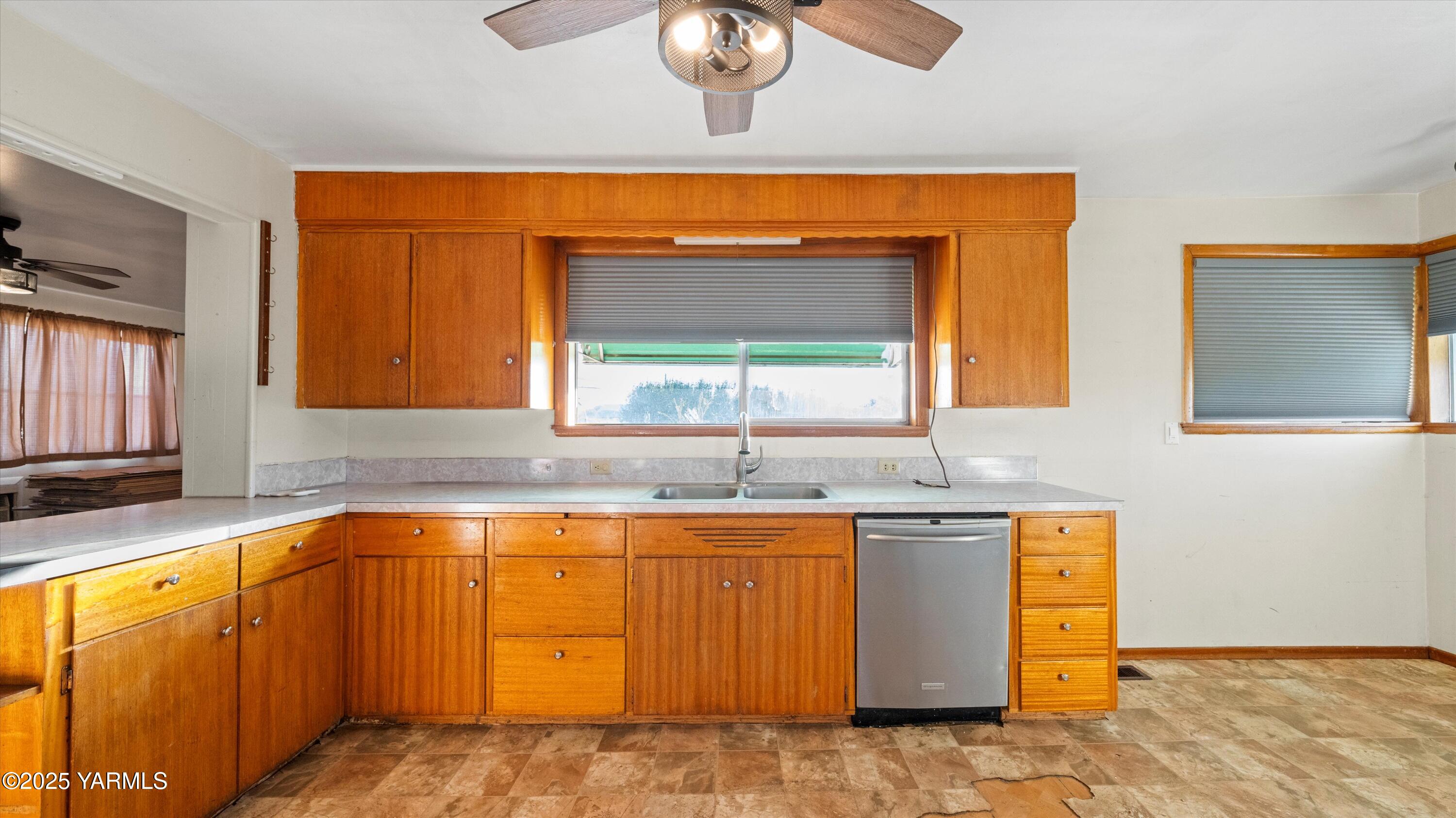 2284 Ashue Road Wapato, WA 98951 - Photo 12 of 25 a view of a kitchen with a sink cabinets and a window