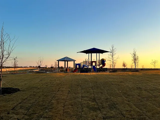 a view of patio with table and chairs potted plants