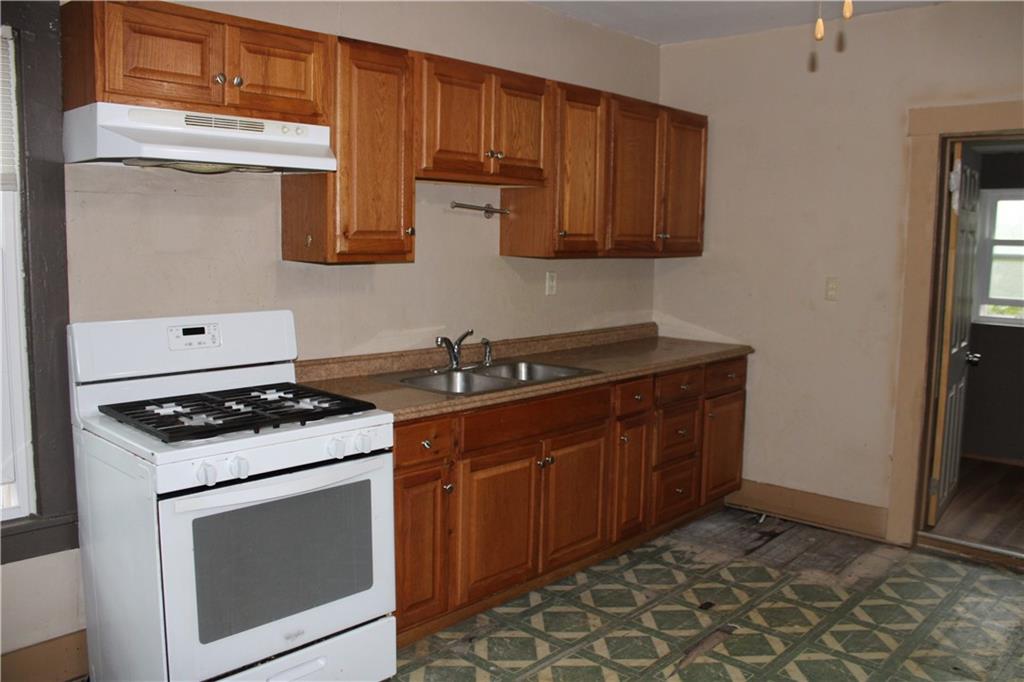 127 Chicora Road Butler, PA 16001 - Photo 4 of 8 a kitchen with stainless steel appliances granite countertop a stove and a sink