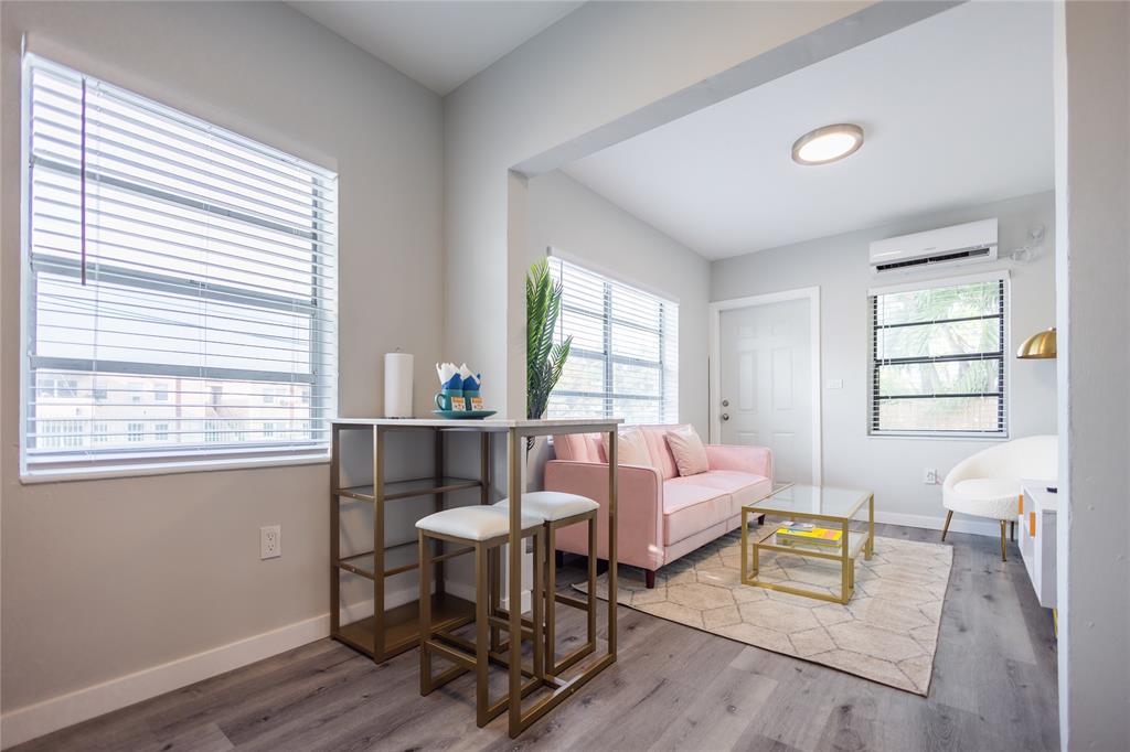 140 Northeast 71st Street, Unit 1 Miami, FL 33138 - Photo 15 of 18 a living room with furniture and a window