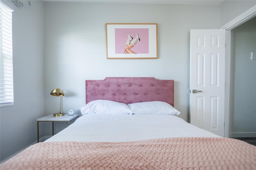 140 Northeast 71st Street, Unit 1 Miami, FL 33138 - Photo 17 of 18 a bedroom with a bed and a painting on the wall