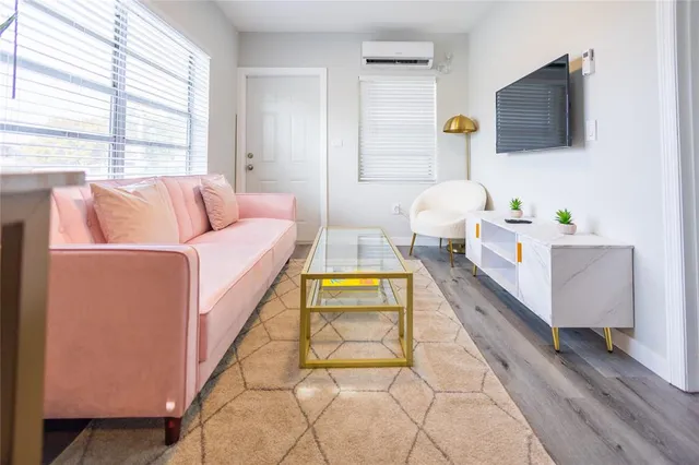 a living room with a couch and a flat screen tv