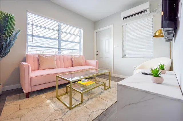 a living room with a couch and a table