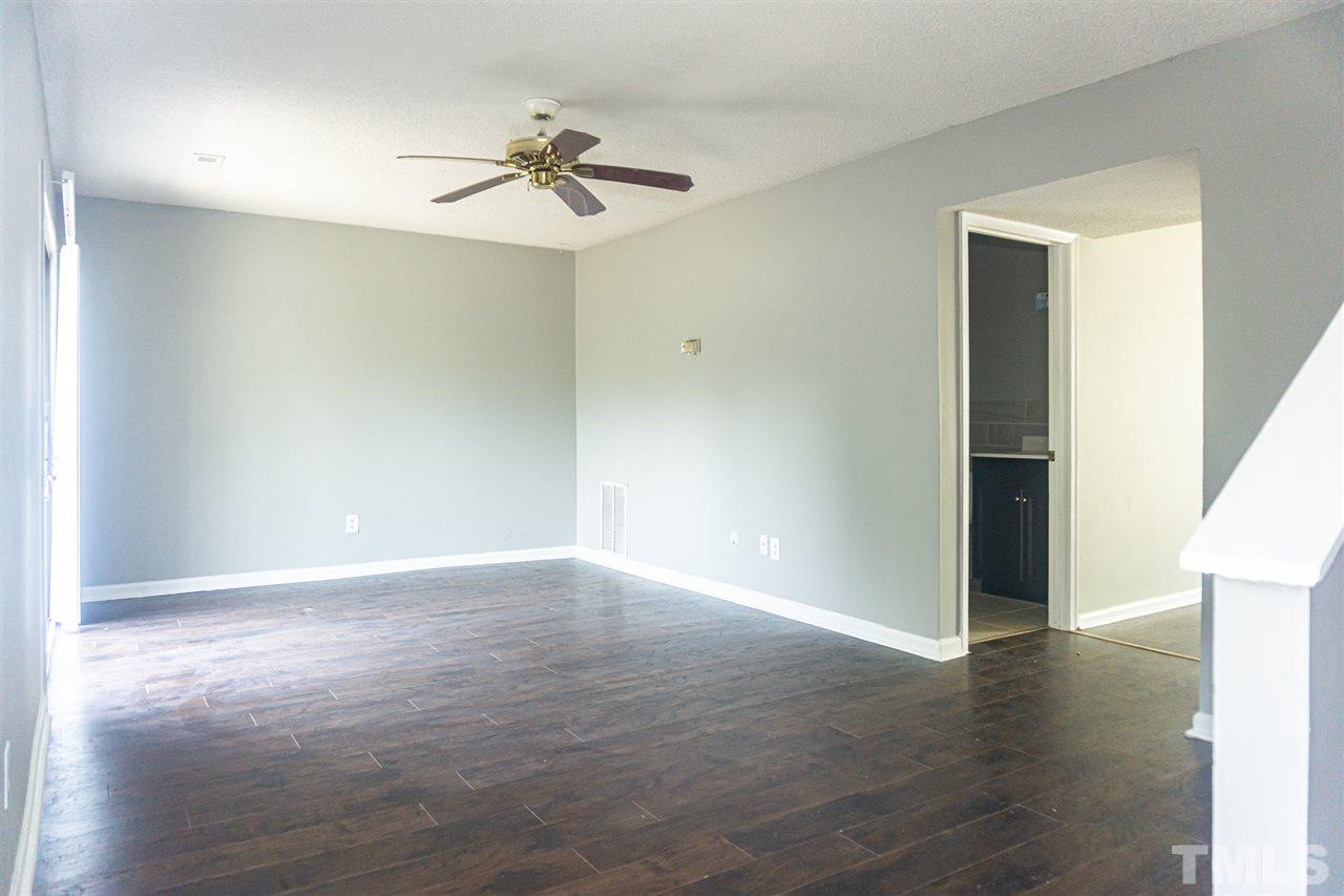 4311 Lake Ridge Drive, Unit 4311 Raleigh, NC 27604 - Photo 7 of 15 a view of an empty room with wooden floor