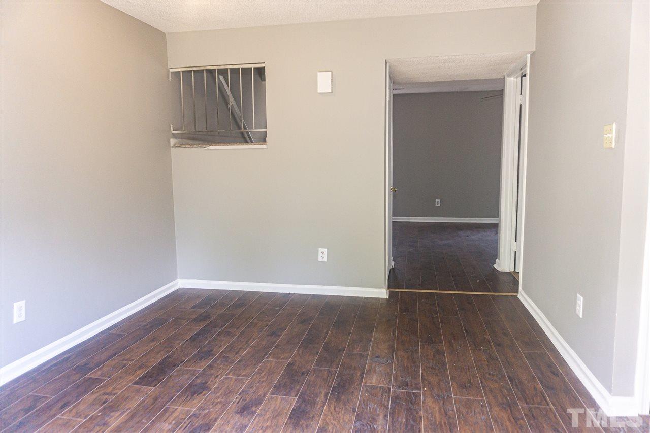 4311 Lake Ridge Drive, Unit 4311 Raleigh, NC 27604 - Photo 8 of 15 an empty room with wooden floor and closet