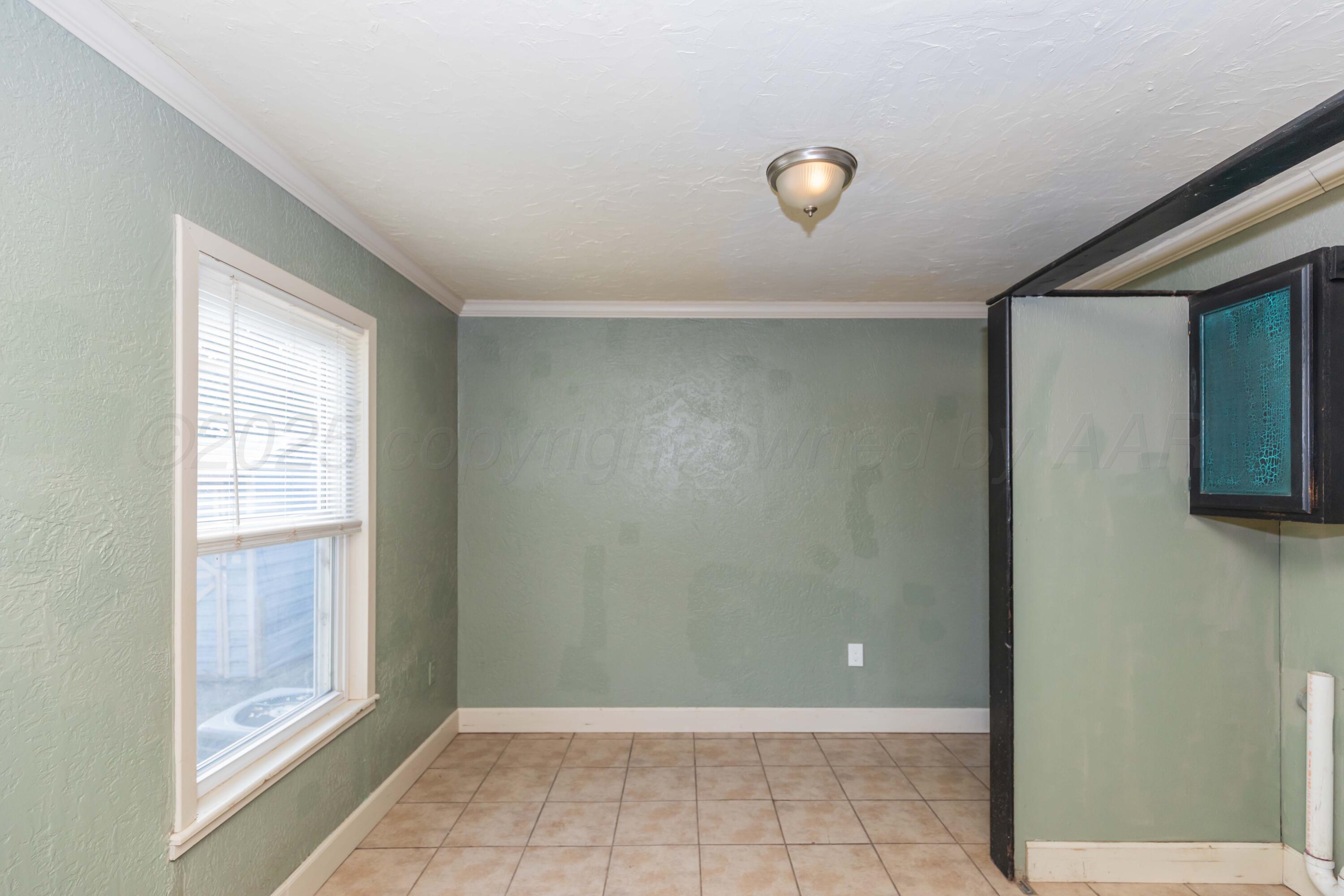 4209 South Lipscomb Street Amarillo, TX 79110 - Photo 12 of 31 a view of a livingroom with an empty space and a window