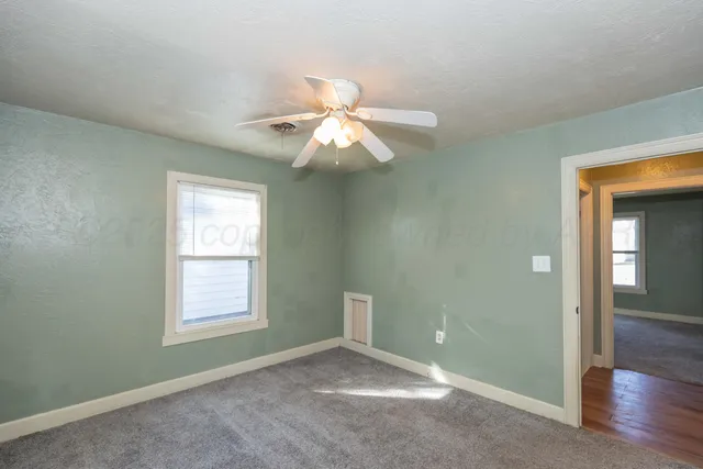 a view of a chandelier fan and closet in a room
