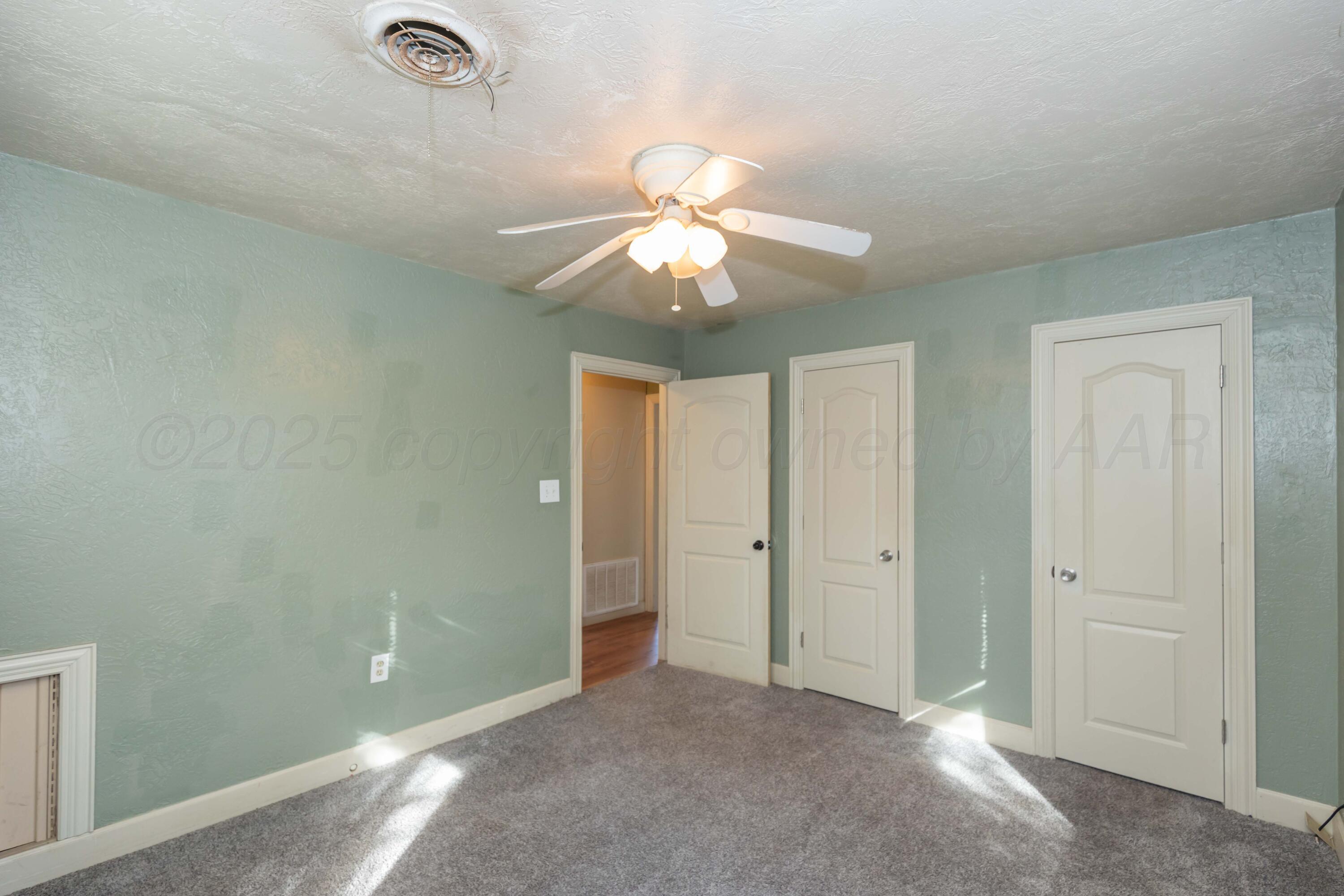 4209 South Lipscomb Street Amarillo, TX 79110 - Photo 23 of 31 a view of a chandelier fan and closet in a room