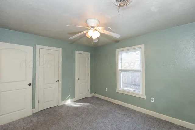 a view of a big room with carpet