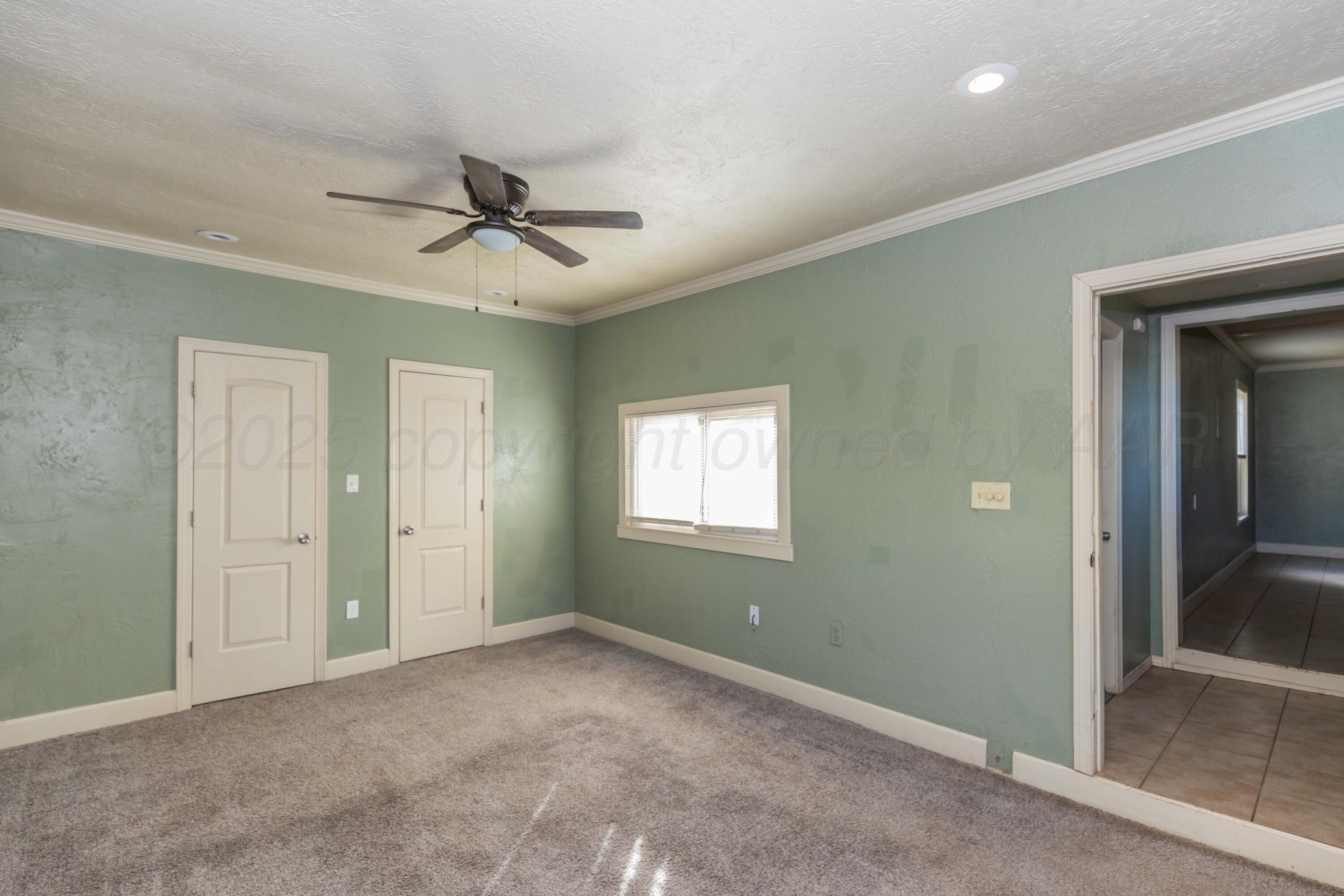 4209 South Lipscomb Street Amarillo, TX 79110 - Photo 26 of 31 a view of a livingroom with a ceiling fan and window