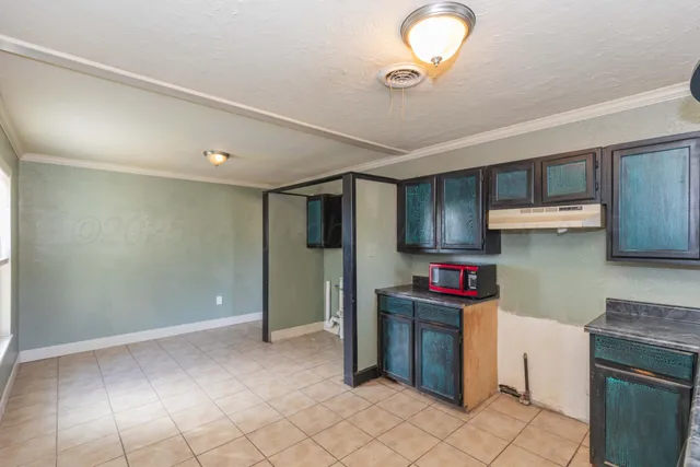 a kitchen with stainless steel appliances granite countertop a stove a refrigerator and a sink