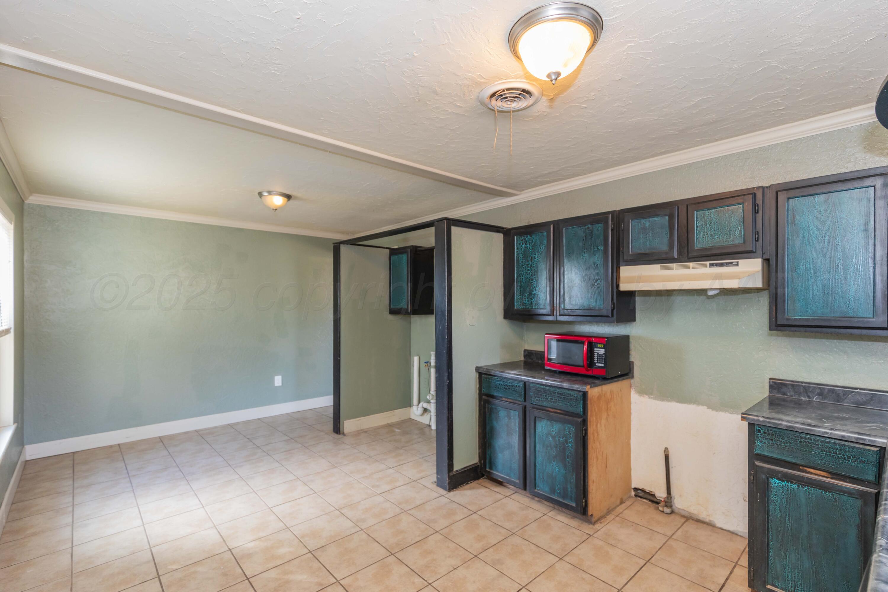 4209 South Lipscomb Street Amarillo, TX 79110 - Photo 10 of 31 a kitchen with stainless steel appliances granite countertop a stove a refrigerator and a sink