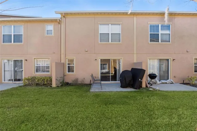 a view of two chairs in the backyard