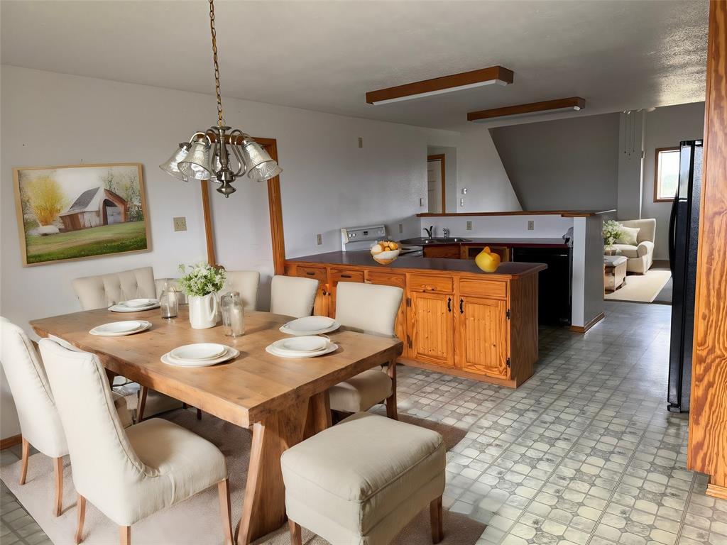 6096 Abner Road Kaufman, TX 75142 - Photo 12 of 21 a dining room with furniture and window