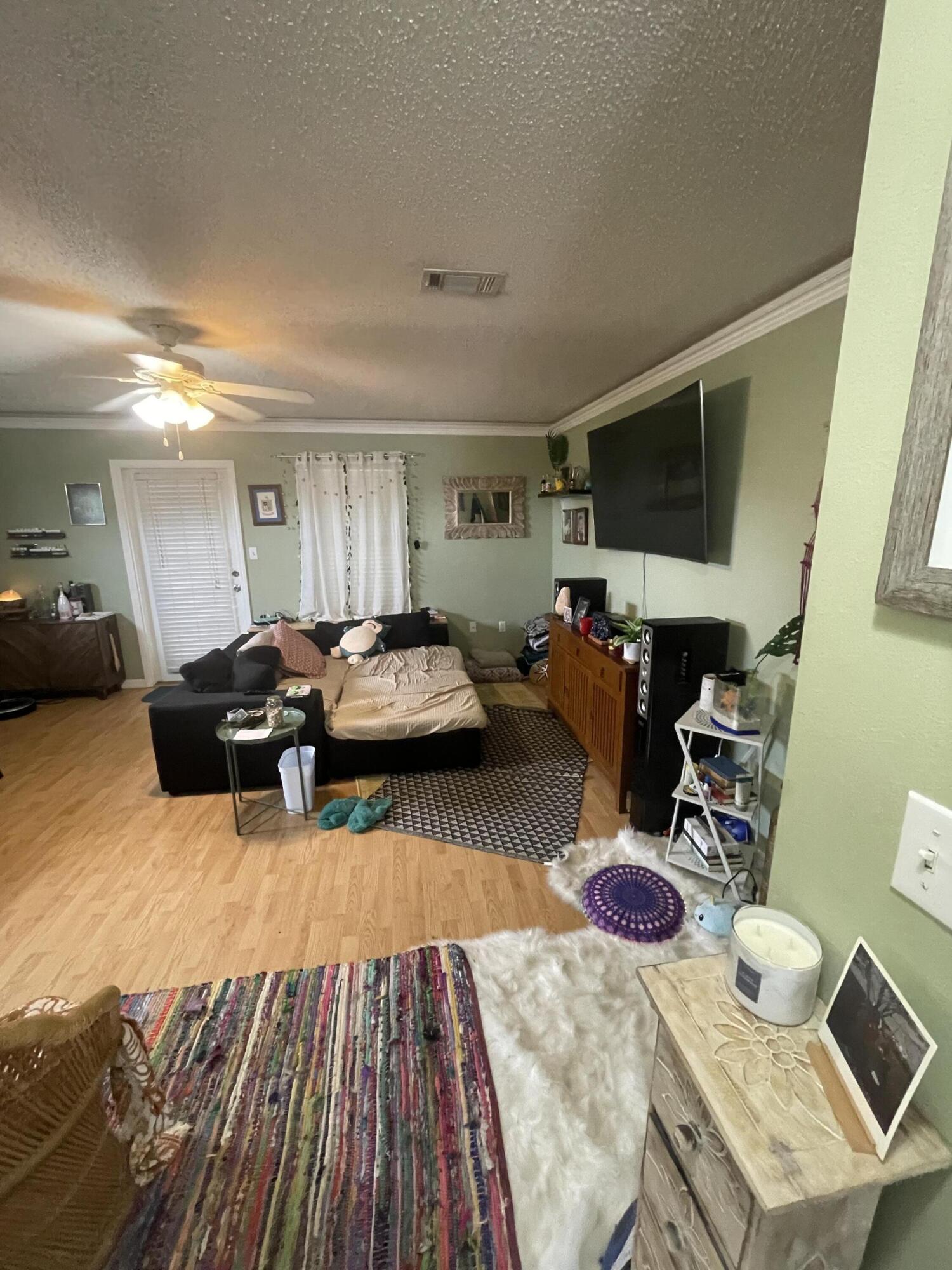 468 Keystone Road, Unit 468 Mary Esther, FL 32569 - Photo 4 of 15 a living room with furniture and a wooden floor