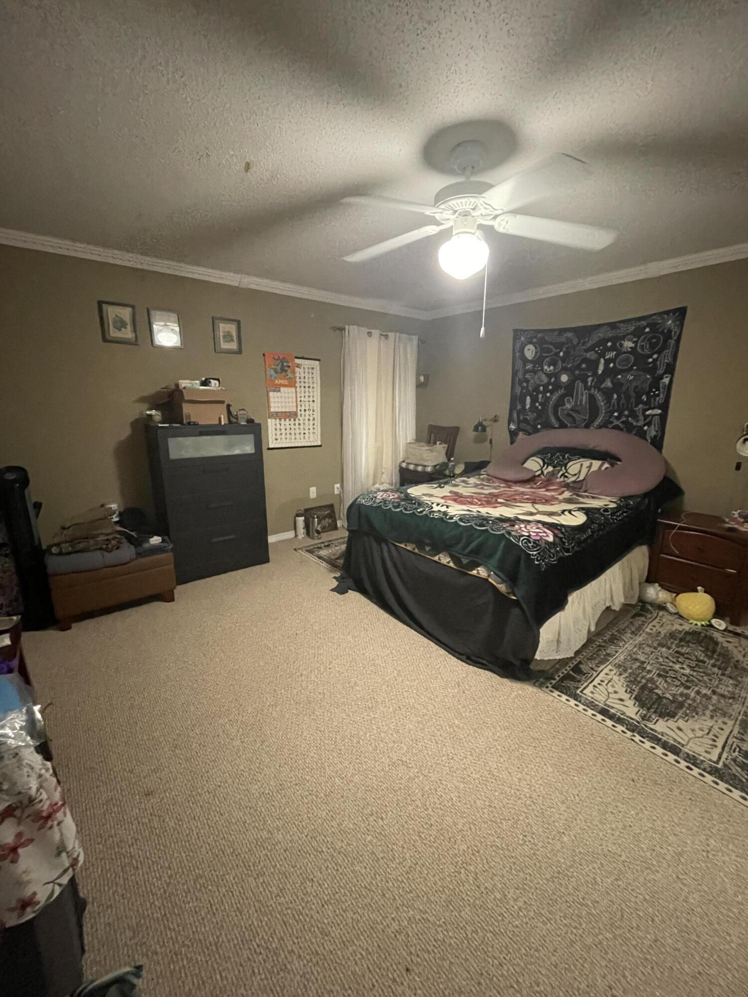 468 Keystone Road, Unit 468 Mary Esther, FL 32569 - Photo 9 of 15 a bedroom with a bed and ceiling fan