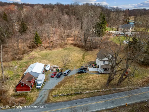 an aerial view of a house with outdoor space
