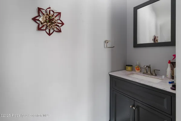 a white toilet sitting next to a bathroom sink