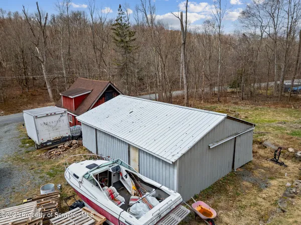 a view of a wooden deck and a backyard