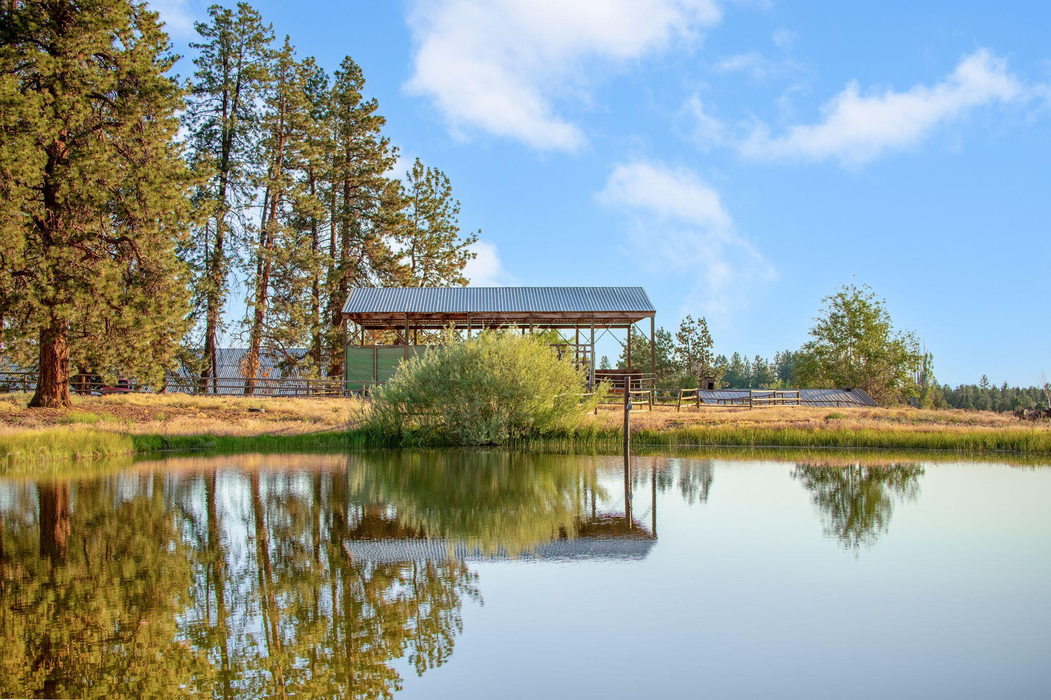 60360 Horse Butte Road Bend, OR 97702 - Photo 6 of 58 a view of a lake with houses in the background